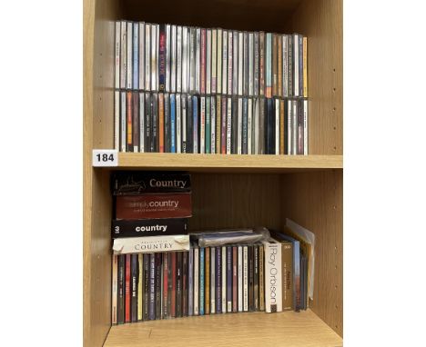 SHELF OF MUSIC CDS AND BOX SETS