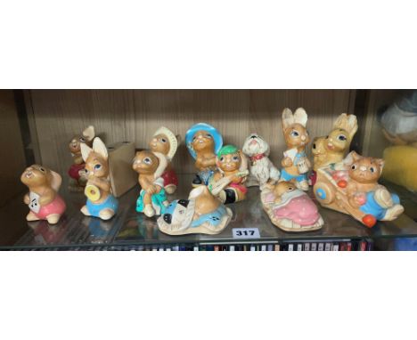 SHELF OF PENDELFIN RABBIT FIGURE GROUPS