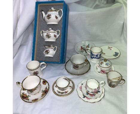 SELECTION OF MINIATURE BONE CHINA CABINET CUPS AND SAUCERS BY COALPORT, ROYAL ALBERT AND ROYAL WORCESTER 