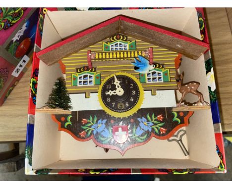 VINTAGE MINIATURE SWISS CUCKOO CLOCK WITH BOUNCING SWING DETAIL AND KEY