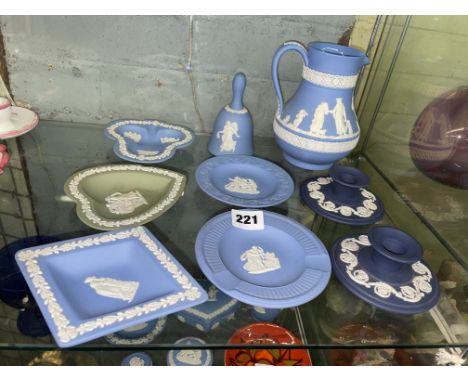 HALF SHELF OF WEDGWOOD JASPER WARES INCLUDING LOZENGE AND CIRCULAR PIN DISHES, BELL, CANDLE HOLDERS