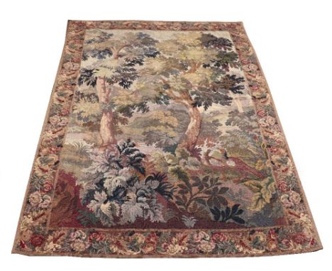 An Aubusson style verdure tapestry, Flemish, possibly 18th century, showing a pair of pheasants in woodland setting, 195cmx30
