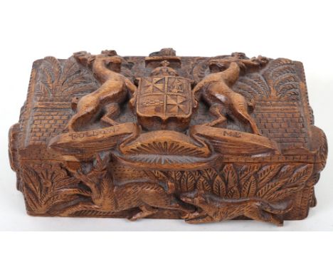 A 19th century Scottish carved wood box with Campbell clan crest and motto to lid, “Follow Me”, the box carved with various h