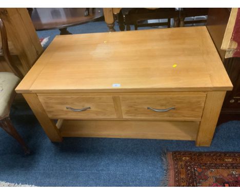 A modern light oak coffee table with two drawers W 110 cm