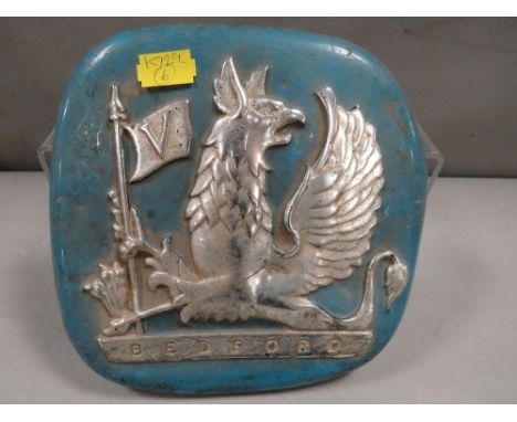 A vintage metal Bedford car badge
