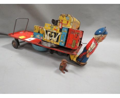 A vintage tinplate clockwork railway trolley