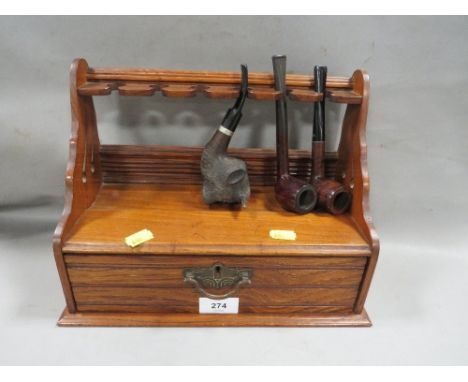 A vintage pipe stand with pipes
