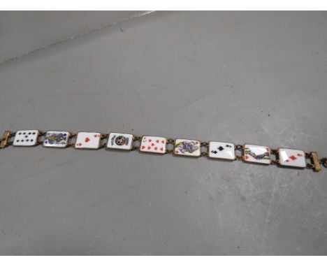 An unusual enamel and gilt metal playing cards bracelet