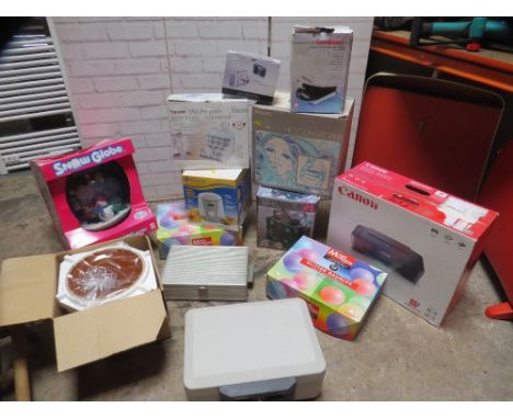 A selection of boxed items to include a printer, cash box, camera, snowglobe etc