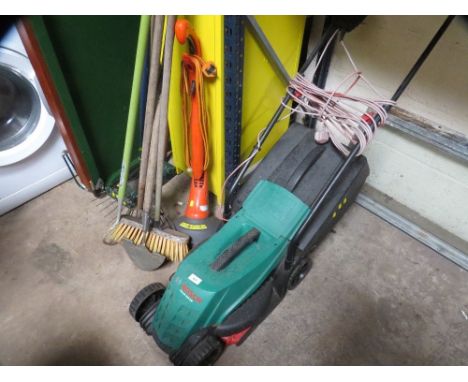 A Bosch electric lawnmower and a selection of garden tools to include a Flymo strimmer