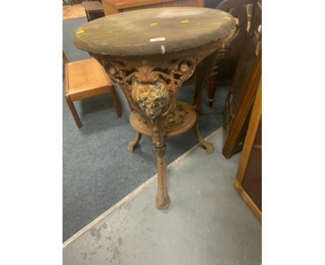 A vintage cast pub style table