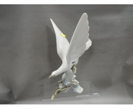 A Lladro figure of a bird