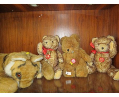 A Merrythought tiger together with three Hermann teddy bears (4)