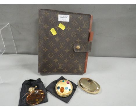 An Estee Launder gem set powder compact etc.,  together with a filofax
