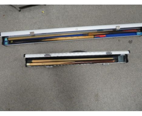 Two vintage snooker/pool cues in fitted hard travel cases