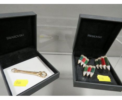 An unusual Swarovski crystal earring and brooch set in the form of coloured pencils together with another unmarked brooch