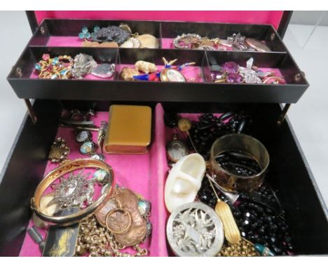 A jewellery box containing various items to include silver, Victorian and vintage jewellery