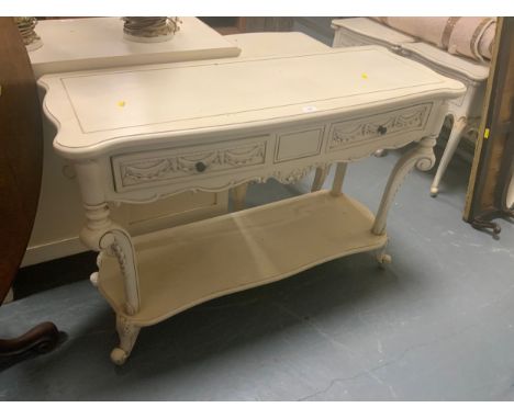 A cream shabby chic style console table with two frieze drawers W 118 cm
