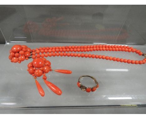 Three pieces of vintage coral jewellery consisting of bracelet, pendant and a ring A/F