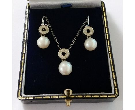 A Pair of Silver Pearl Earrings with Matching Pendant.