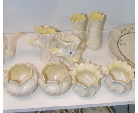 Eight Pieces of Belleek - two pairs of cache pots, a pair of tree trunk vases & a pair of vases with castellated tops. Most 3