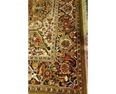 A Large Green Ground Wool Carpet with traditional medallion design.