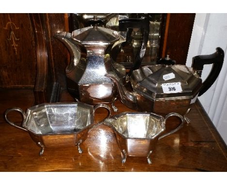 A Large Quantity of Silver-Plate Items to Include a Four Piece Tea/Coffee Service, Five Urns, Sugar Scuttle, Set of Cruets, T