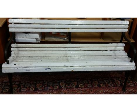 A Victorian Cast Iron Garden Bench, with slatted plank wood back rest and seat. 5ft wide approx.