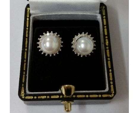 A Pair of White Gold, Diamond and Pearl Earrings.