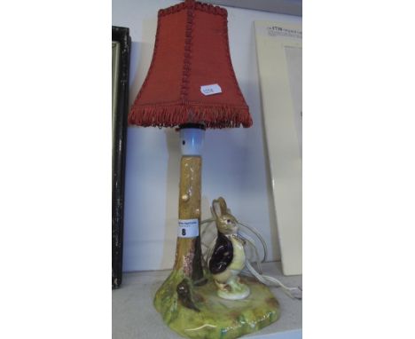 A Beswick Figural Table Lamp modelled as a tree trunk with Rabbit figure beside, red shade.