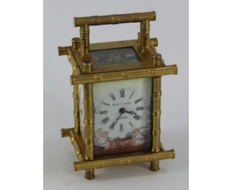 An Elliott & Son miniature brass carriage clock, enamel dial bearing Roman numerals, and side panels painted with cherubs, ca