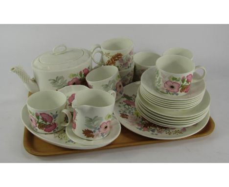 A Wedgwood porcelain part tea service, decorated in the Meadow Sweet pattern, comprising teapot and stand, cream jug, sugar b