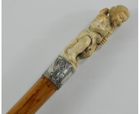 A Victorian malacca walking stick, with antler handle carved on a cherub, engraved silver ferrule with shield reserve, Birmin