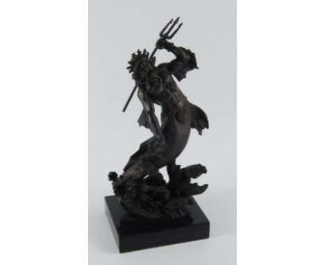 A bronzed figure of Neptune, modelled holding his trident whilst riding the crest of a wave, raised on a rectangular block sl