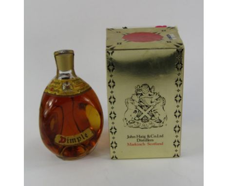A bottle of Haig Dimple Scotch Whisky, with box.