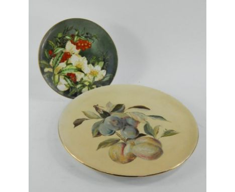 Two Victorian painted dishes, one pottery painted with hanging fruit, monogrammed L R, 36cm diameter, the other Copeland pain