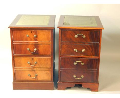 A pair of mahogany two drawer filing cabinets, with tooled green leather tops, raised on bracket feet, 51cm x 59.5cm x 79.5cm