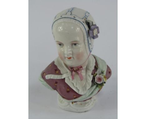A Meissen porcelain kinderkopf, modelled facing right wearing a bonnet, with floral encrusted sash, Augustus Rex mark, 15.5cm