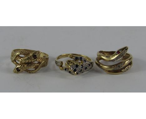 Three gold and gem set rings, comprising a 9ct gold sapphire and diamond set panther ring, size R, 9ct gold entwined serpent 