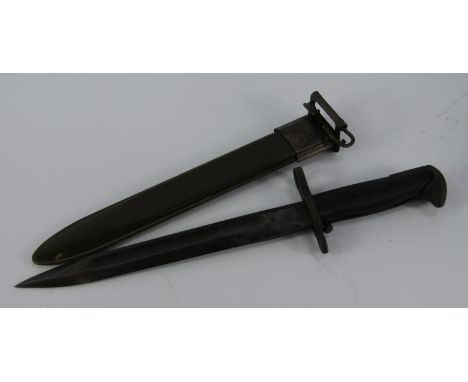 A US Army bayonet 1943, blade dated and impressed S.W.I, green metal sheath, 40cm long.