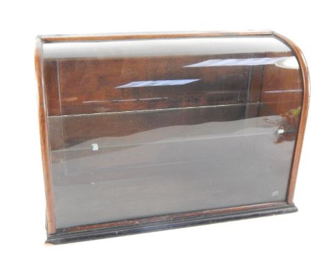 A Victorian wooden shop display case, with a curved glass front, single glass shelf, 51cm x 20cm x 34.5cm