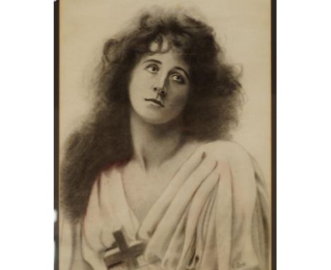 T Lewis (British 19th/20thC). Half length portrait of a girl holding a cross, charcoal, signed, 49.5cm x 35cm.