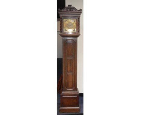 An oak longcase clock, early 20thC, the square brass dial with floral spandrels, chapter ring bearing Roman numerals, eight d