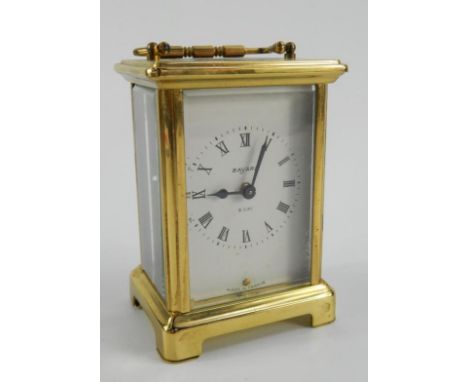 A Bayard brass carriage clock, enamel dial bearing Roman numerals, eight day single barrel movement, 8cm x 6.5cm x 12cm.