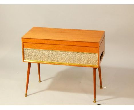 A teak cased Spinney record player, with BSR, brass trim and fabric front panel, raised on tapering, cylindrical legs, brass 