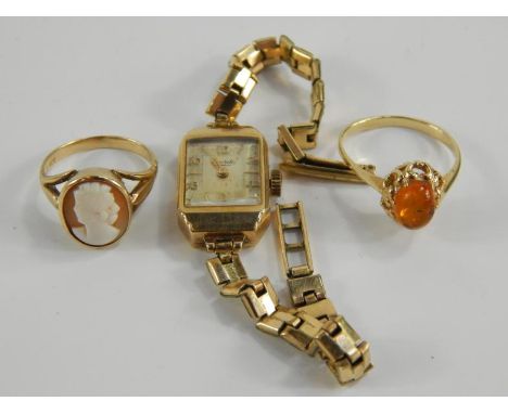 Jewellery, comprising a yellow metal and amber ring, marked 585, size O, yellow metal and cameo ring, marked 9ct, size K, and