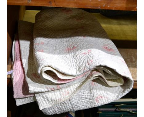 Early 20th century pink and white striped quilt with pink floral reverse, 245cm by 210cmSome light staining and wear