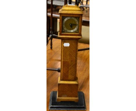 An oak Elliott miniature longcase clock  