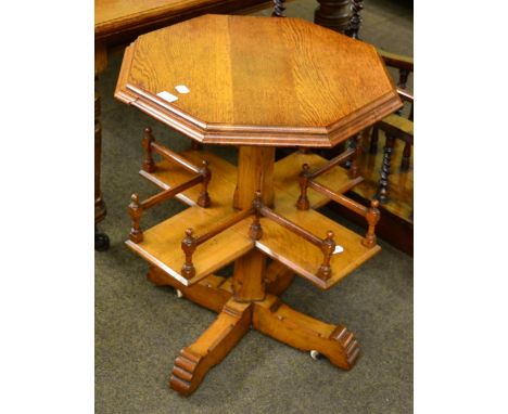 An early 20th century oak octagonal occasional table with cross form shelf