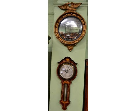 An inlaid rosewood aneroid barometer, together with a reproduction convex mirror in the Regency taste